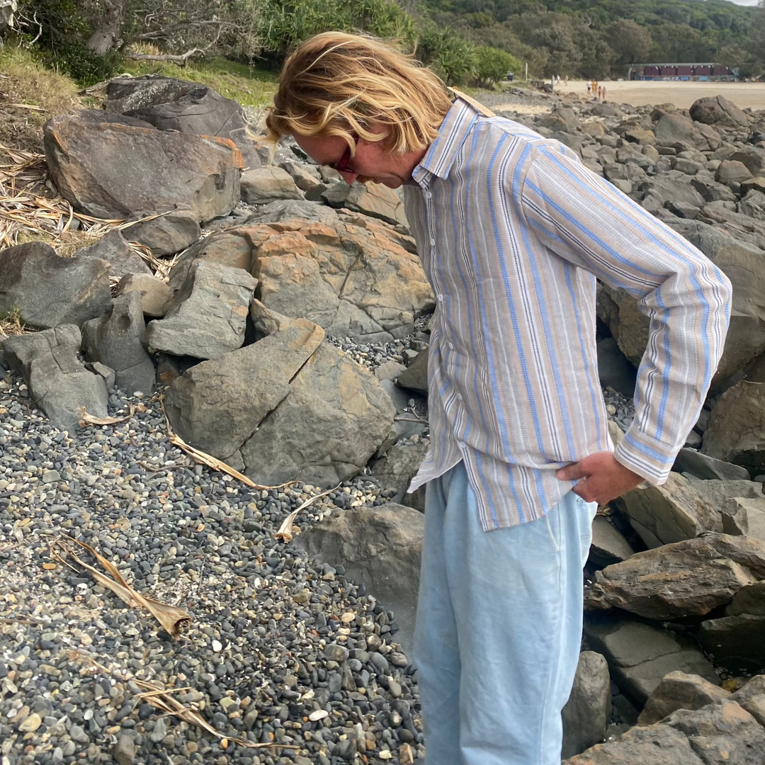 Dan wearing SaltySeas Coastal Stripes Linen Shirt on a sunny beach